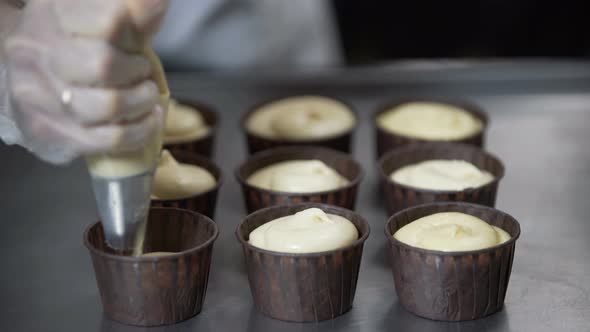 Pouring Cake Dough Into Muffin Tray