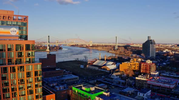 East River Amidst Buildings in City Drone Flying Backward From Skyline