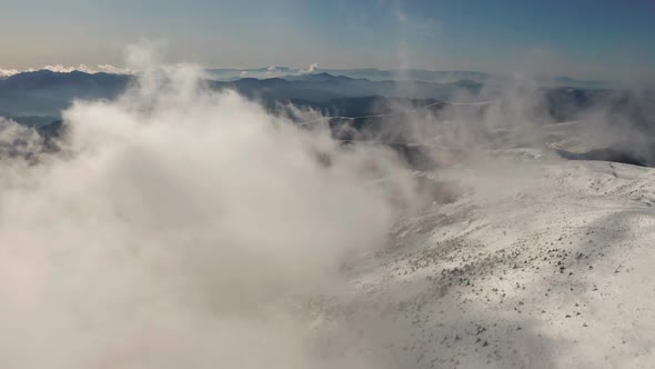 Beautiful Winter Aerial Flight Over Mountain