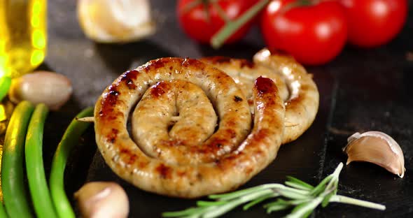 The Fried Sausage Slowly Rotates on the Table. 