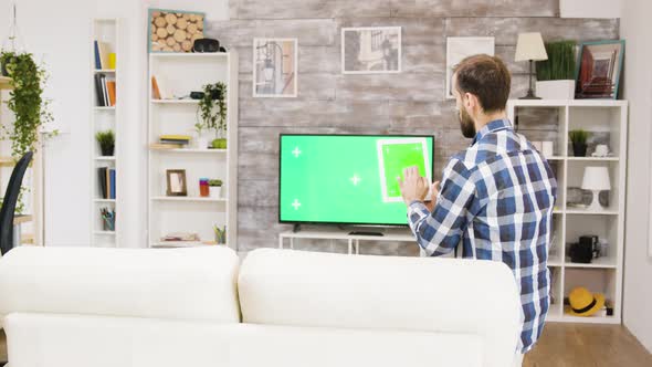 Back View of Young Man Sitting on Couch