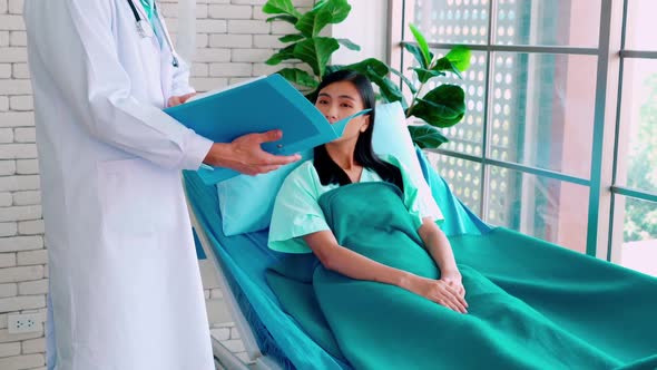 Doctor in Professional Uniform Examining Patient at Hospital