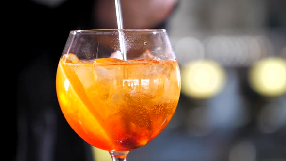 Barman is making alcohol cocktail, close-up