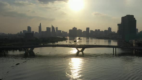 tracking across classic view and establishing shot of Saigon river, Vietnam from drone with view to