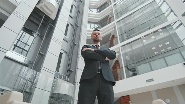 Low-Angle of Male Lawyer in Big Office