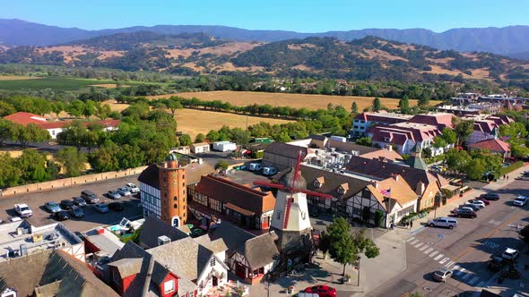 Slow rotating drone shot of the large wind mill in Solvang Ca.