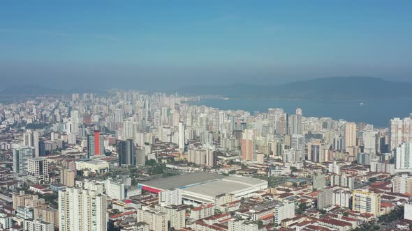 Panning wide landscape of coast city of Santos state of Sao Paulo Brazil.