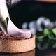 Pastry Chef Decorates Biscuit with Purple Cream From Pastry Bag, Close-up. - VideoHive Item for Sale
