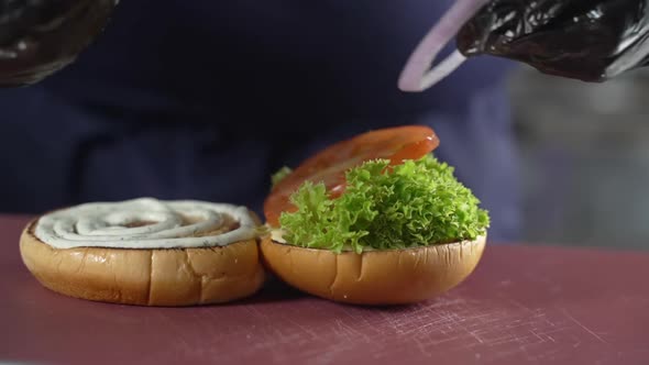 Preparing a Burger with Onions