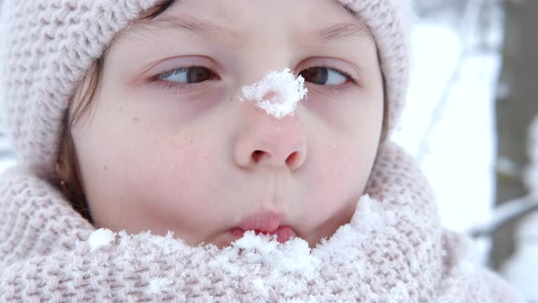 Child nose in snow