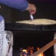 Female making Bread In the oriental courtyard. lit the firewood to bake bread - VideoHive Item for Sale