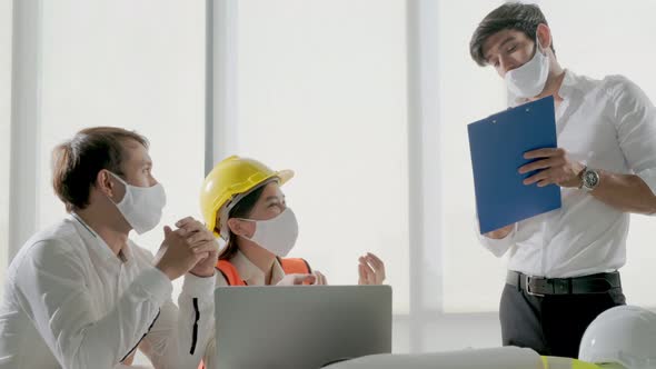 group of engineer caucasian male and asian female serious concentrate meeting