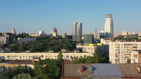 Aerial drone video of downtown skyline buildings and cars on the highway in Pecherskyi district of K