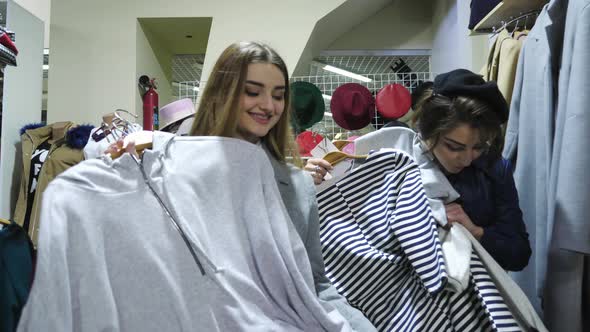 Girls walking laughing in a store