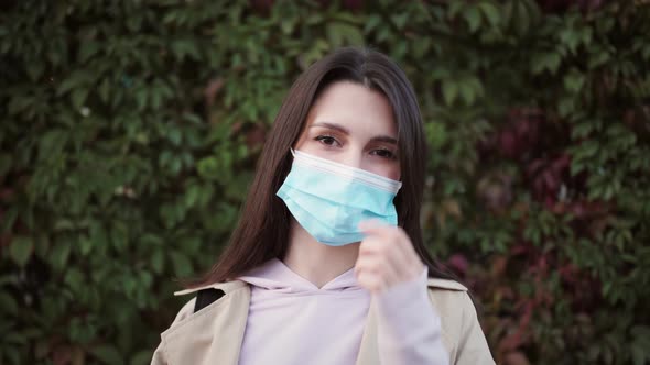 Young Hispanic Woman Wearing Protective Mask Against COVID Virus Tourist with Medical Mask Public