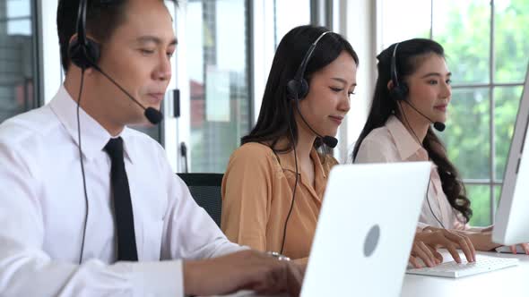 Business People Wearing Headset Working Actively in Office