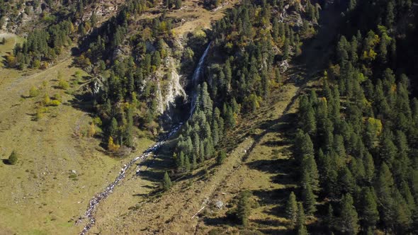 Drone aerial view of a waterfall in Lüsens Valley in october, located in Austria