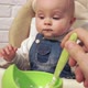 Baby is Waiting for Start of Feeding Without Waiting Dips His Fingers in Food - VideoHive Item for Sale