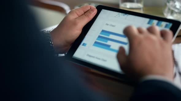 Finance Professional Using Tablet