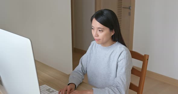 Woman work on computer at home