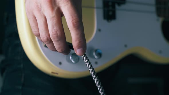 Professional Bassist Checks Quarter-inch Jack Wire