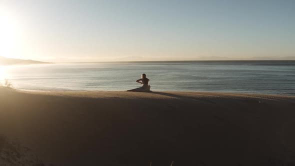 Dancing Woman On Sunlit Sandy Beach