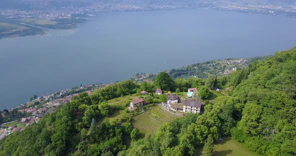 Aerial drone view of the green hills above Lake Maggiore, Switzerland.