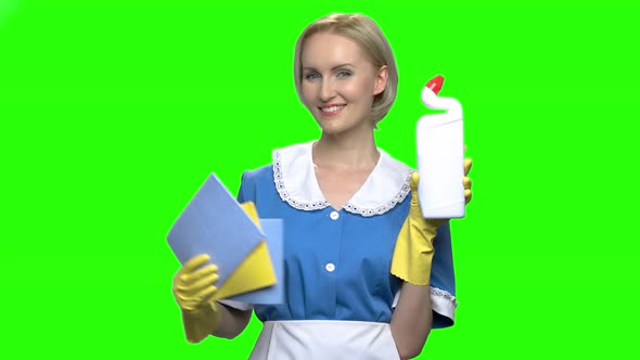 Woman with Toilet Cleaner Bottle and Napkins for Cleaning