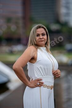 Woman in white with jewelry