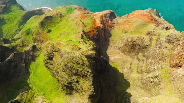 Aerial View Flying Over Jungle Mountain Peaks Revealing Tropical Coast Na Pali