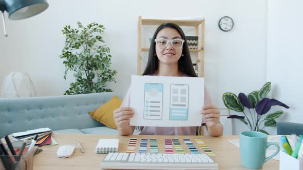 Cheerful Young Woman Designer Talking About Colors for Mobile Apps During Online Video Call at Home
