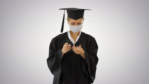 Graduate Student Using Sanitizer To Dry Clean Her Hands on Gradient Background