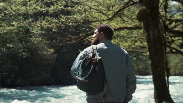 Male Hiker Is Taking a Walk in the Forest.