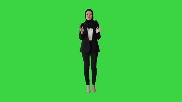 Confident Young Muslim Business Woman Wear Hijab Speaking To Camera on a Green Screen, Chroma Key.