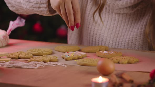 Decorating Freshly Baked Gingerbread with Colorful Edible Sugar Sprinkles