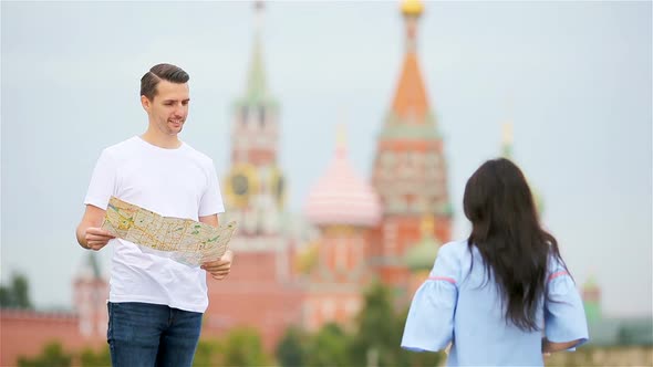 Happy Young Urban Man with Map in European City.