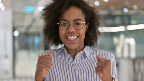 Excited African Businesswoman Celebrating Success