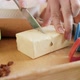 Closeup of Woman Cutting Butter for Cooking Pie or Cake - VideoHive Item for Sale