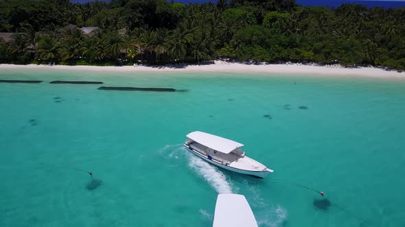 Aerial above tourism of tranquil resort beach voyage by blue water and white sandy background of a d