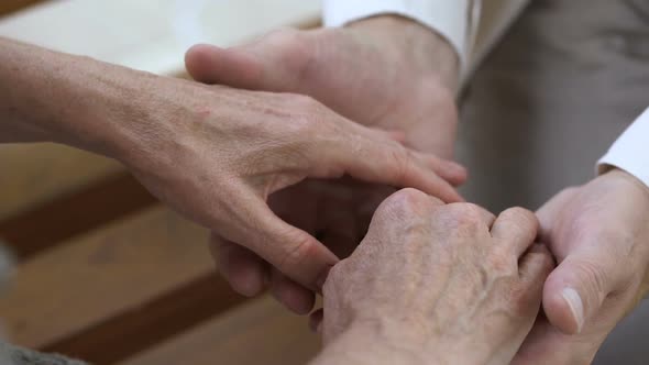 True Love Through Hard Times, Man Holding Old Female Hands, Support and Care