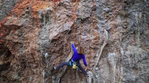 Cinematic Slow Motion Footage of Strong Female Climber Climbing Very Hard Overhang Route Clipping