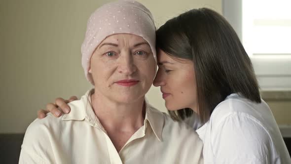 Young Woman Hugs Her Sick Mom After Chemotherapy