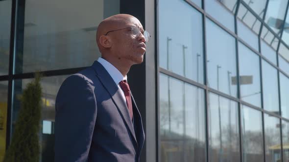 Pensive Elegant African American Businessman Looking at Camera Close Up