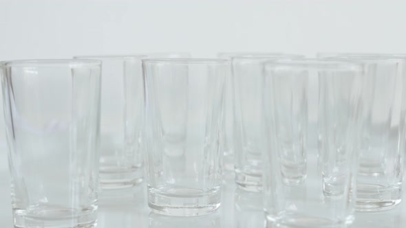 Empty transparent  spirits or liquor drink glasses 4K 2160p 30fps UltraHD footage - Close-up of shot