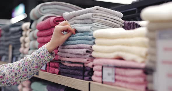 Female Hand Take a Towel in a Supermarket