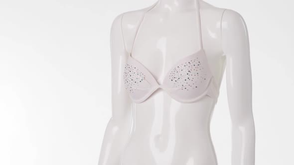 Mannequin Wearing White Swimsuit.