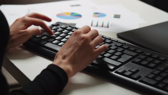 Woman hands typing on computer keyboard.