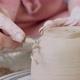 Female Potter Sitting and Makes a Cup on the Pottery Wheel. Woman Making Ceramic Item - VideoHive Item for Sale