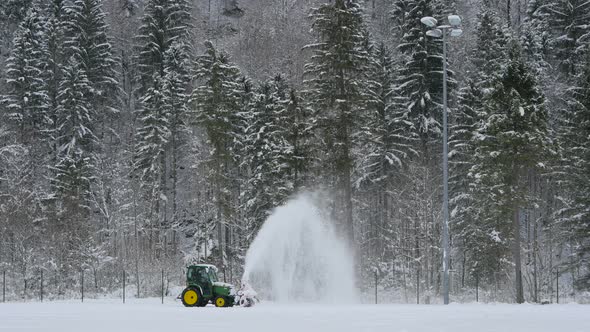 Tractor shoveling snow