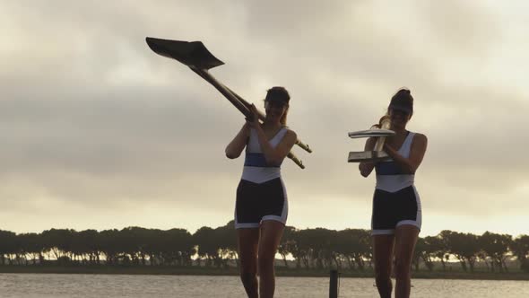 Female rowing team training on a river